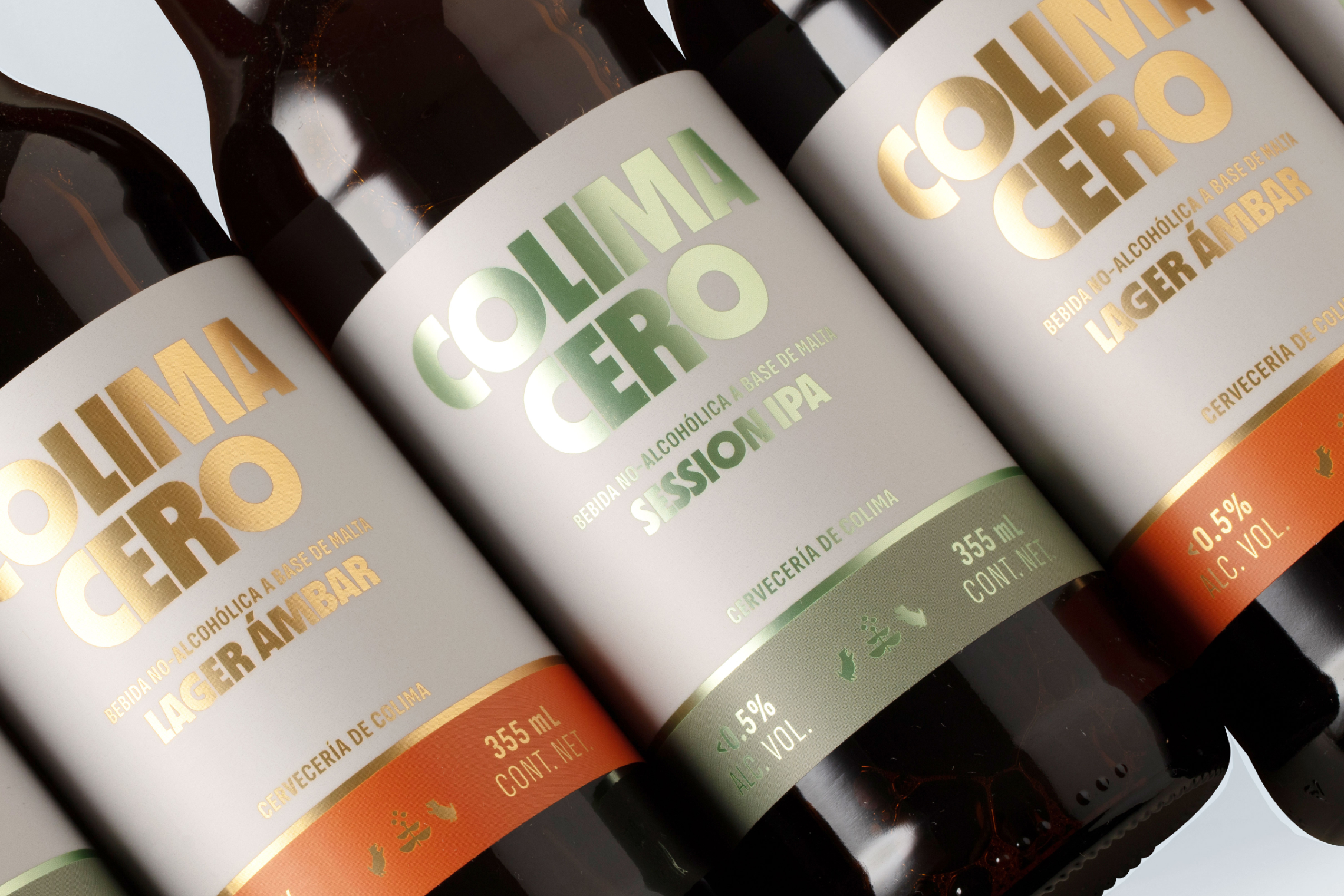 Product photo of Colima Cero bottles with gold and green metallic labels.