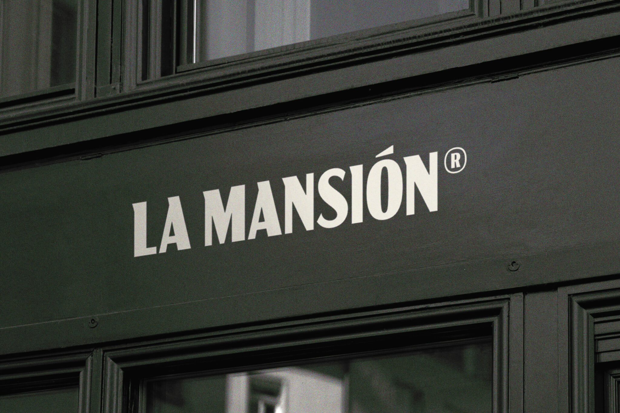 La Mansión wordmark on exterior facade.